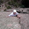 Albert Kettner on the flared crack near the top of Monastic Groove.