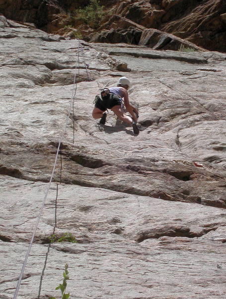 Nickie Kelly working the thin seam just below the crux.