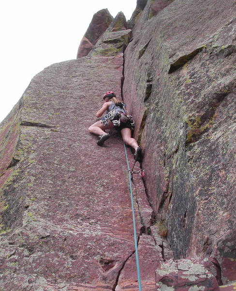 Christa Cline starting the crux section of Star Wars.  Sustained jamming for the next ten feet leads to a small ledge on the right where the leader can shake out and rest.