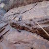 Tony trying the 12a direct variation. You can see tthe left facing, right leaning corner directly below Tony below the roof and ledge.