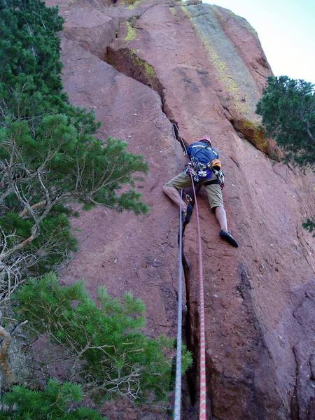 The crack angles right then left, and it's steep, so it's harder than it looks. Some foot holds on the bottom half help.