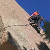 Charlie at clipping the second bolt on Topo.  The crux of P1 can be protected by a #3 camalot below the lip of the overlap.