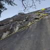 View over the dihedral to the ledge and horizontal crack above it - it takes cowbells but be warned it is often dirty and liable to make your gear walk more than expected - extend!