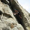 Marga Powell at the crux.  Small cams provide good protection for the insecure moves to the top of the corner.