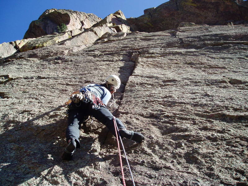 Brass in mouth, getting the first piece in. 5.8 bouldering gets you to this point which is maybe 10' off the ground.<br>
<br>
Photo by Luke Clarke.