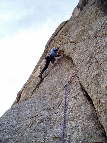 Starting up P3 5.7 or 8? The guidebook said this wandering pitch was 5.5 and 5.7 (or 5.7 then 5.5?), but there were several hard sections. We ran the pitch (with a 70m rope) all the way to the end of the leftward "hike" from the base of the Black Dihedral to the base of the right facing corner.<br>
<br>
Photo by Luke Clarke.