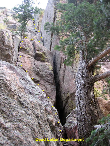 Dead Letter Department.  Climb a right-facing corner to a tree, then move right and continue up.  A direct start up the wide crack is also possible. <br>
<br>
When the difficulties end, angle right to a rappel, or continue up and left through a broken area to Lightning Bolt Crack.