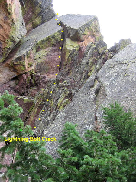 Lightning Bolt Crack.  Belay on a ledge by a small tree below the crack.  Climb broken rock to the crack and layback up to the wide slot. I did the wide slot right side in with good jams for the right hand. <br>
<br>
Jam to the top of the crack and continue with the last pitch of Handcracker Direct.<br>
<br>
Just to the left of the route is the V-slot of Mail Ridge.