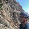 The top of the second pitch, chilling at the tree belay. The start of last pitch traverses right and goes for the deep crack in photo and then the ridge.