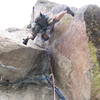 Through the crux.  Note that Brenda's right foot is still on the same foothold as in the previous photo.