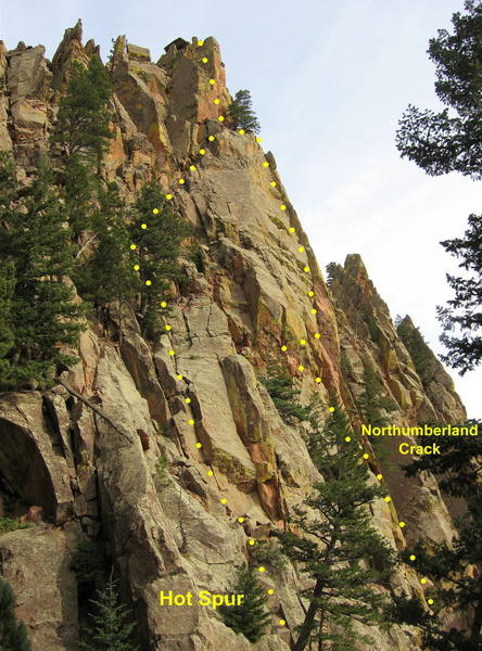 The upper pitches of Hot Spur.  Climb straight up short steep corners to a a series of ledges with trees.<br>
<br>
Climb through a broken area, then move up and right on loose ramp toward a big pine tree near the top of Northumberland Crack.<br>
<br>
Just left of the tree climb a steep juggy wall to the top.<br>
<br>
It's also possible to climb to the top farther to the left; this is mostly fourth class and loose.