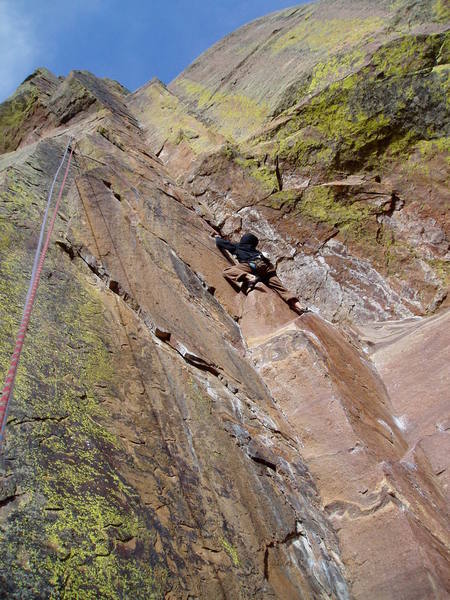 TR'ing, on the upper crux. A couple hard moves get you to a big hold, but it's still pumpy after that. Unbroken Chain is the undercling flake down and left from Adrien.