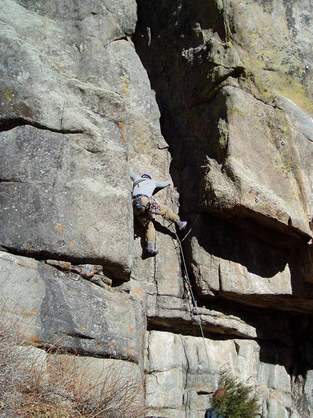 Stem the right facing corner off the ground until above the overhang, then more stemming, etc. gets you to the ledge above Chuck where it eases off afor a while.