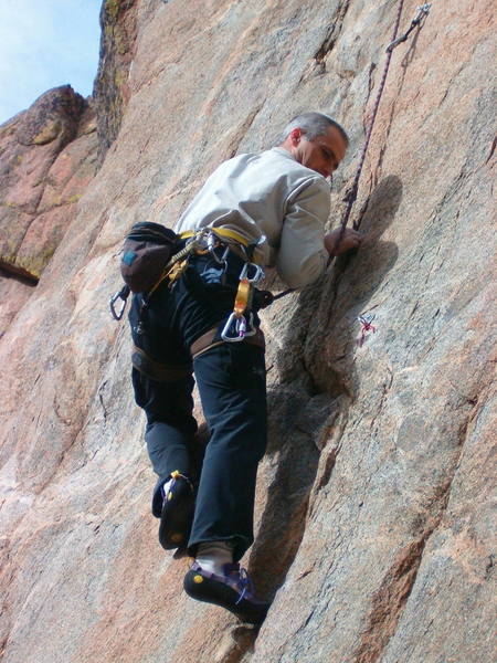 Tom at the first crux past the 3rd bolt, eyeing his next foothold.