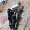 Tom at the first crux past the 3rd bolt, eyeing his next foothold.