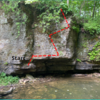 Start with hands on the white outcropping and feet on the boulder below and then traverse right and then up