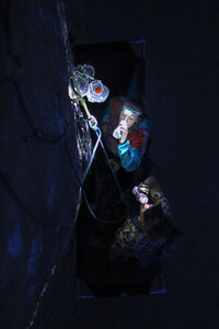 Climbers re-fueling between burns at the p1 hanging bivy of 9 Gallon Buckets.<br>
<br>
Artem Vee photo