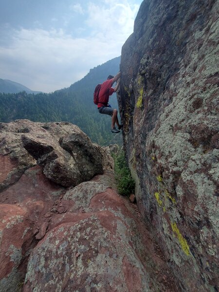Optional bouldery moves at the upper headwall.