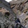 A climber heading up the highly-recommended direct start (5.9). Look for an impossible-to-miss large dihedral ~100ft right of the CB start.