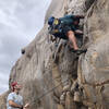 Low piece placed to protect the belay stance which is on a sloping ledge.  Start has great hands and feet.