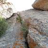 There are a few options for pitch 3. Either climb one of these crack systems, or climb the crack on the outside of the face on the right, out of view in the photo. The crack to the right is the route described in the guidebook.