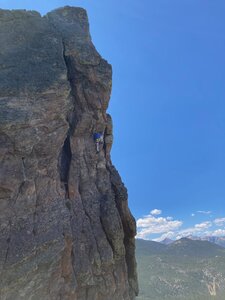 Rhonda B. climbing into the bulging crux section of Petrified as she just passes bolt 7.