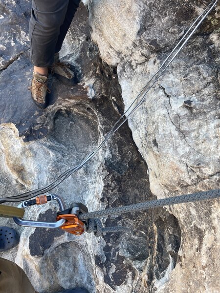 70m edelrid rope, top roping from the anchor with single length slings as our anchor material. I rapped back to this ledge with a foot to spare.