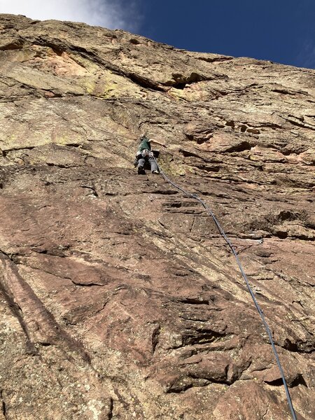 At the piton on the 1st pitch.