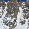 The blue line - approach to buttress. The yellow dots - the main route & blue circles mark approximate belays. The green dots - alternate start that adds a pitch of M4-5 in a corner system. Traversing a snow bench is required to rejoin the main line.