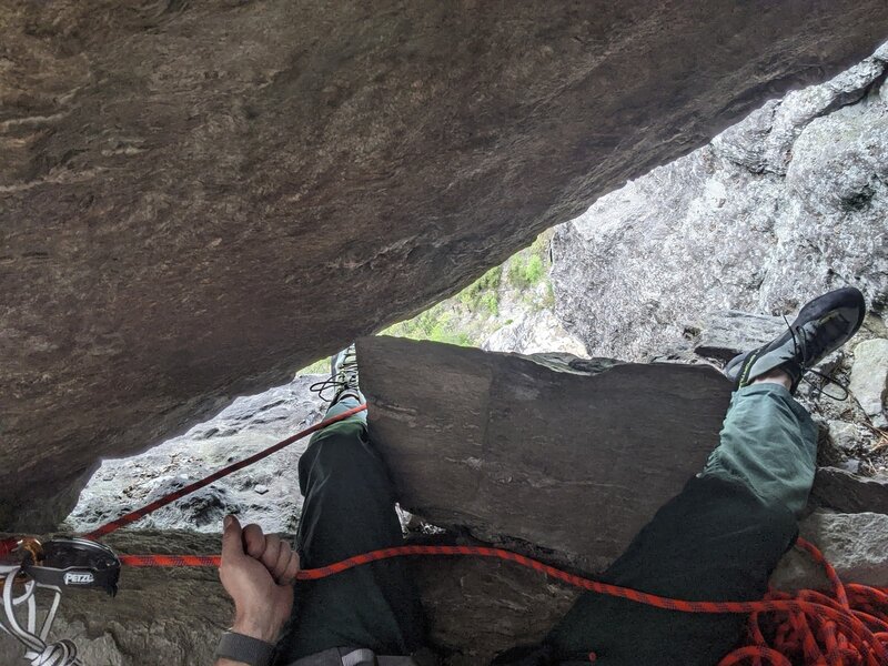 Alcove belay station suggestion.  Use the rock behind you as back rest and pinned "microwave rock" straddle for one of the most comfortable belay from the top positions on the route.  edge pro (out of picture) on other side of this rock.