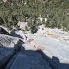 Looking down from the top of P3. Climber below is on the iconic Dogleg crack.