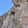 Chris working the double cracks near the top of Ace of Spades