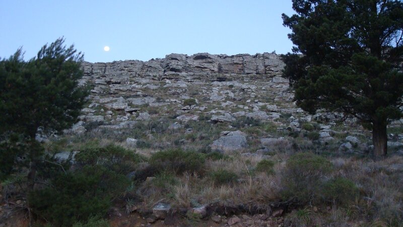 Looking up at the main sector of el Autodromo, the moon, and some of the pine trees mentioned in my approach beta, lrom the dirt road at the base.