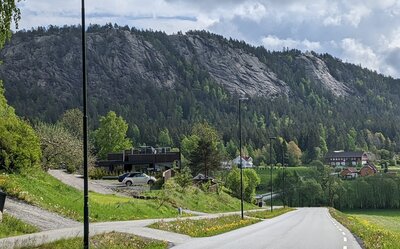 An overview shot of the three cliffs at Vardåsen as viewed from Dikemark. The central of the three cliffs is the middle cliff.