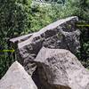 From the trail above, Sickle anchor on left side of block. New Edges and Ledges TR anchor on right (flip your anchor over the top of the block; avoids the exposure of setting up the original anchor on the face)