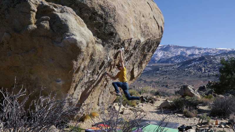 Kyle Love sticking the early crux move to Cindy Swank