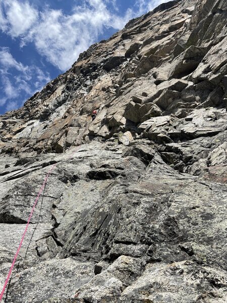 Carter on P.6, belaying from the top of the loose 5.8 chimney