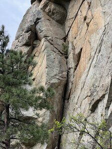 Climb up the dihedral, and exit left onto Northwest Corner.