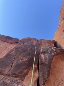 Connor resting in the pod before the crux on his onsight send