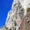 as seen from castle cliffs. Arrows are approximate. After gaining the great white wall on right side, go up a short-ish ways (less than a full pitch) before snaking left again. Route traverses significantly left to rotten chimney.