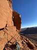 Luke leading the last pitch. We slung this boulder to the right of the bolted anchor to belay for the last pitch.