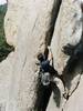 Marc Hemmes placing gear at the crux of Strawberry Shortcake.