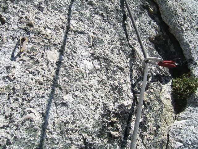 Original bolt as you got to the flake on pitch 3. The #1 camalot is in the thick, solid part of the flake (it gets thinner higher), and this bolt really wasn't needed - with modern cams at least!