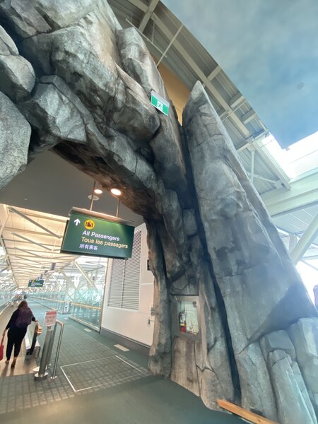 Get a flight that brings you to Terminal E, intl arrivals, and right as you step off the plane, locate the obvious splitter fist crack. Roof above means it should stay dry in a downpour. Watch out for airport security upon descent!