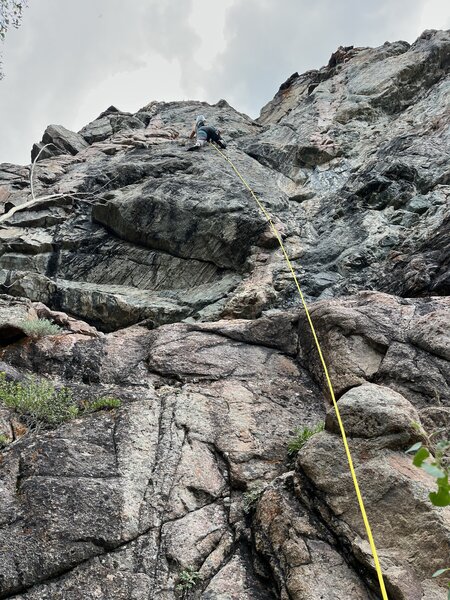 A climber leading the 5.8, the leftmost route at Warrior Wall.