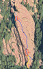 The route with cruxes shown and approximate belays circled. If using a 60m rope and following the low direct start (yellow, 5.6), you need to set a belay before the first crux (yellow circle). Skip the next belay, and continue up. Three pitches.