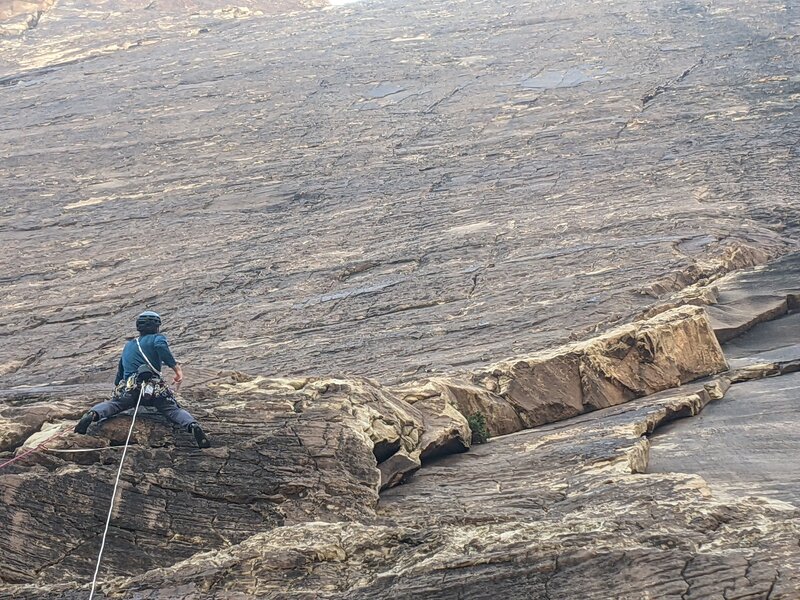 At the top of pitch 1 placing some gear.