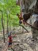 Daniel Vaughn working on the cruxy move at the first bolt of Horny Goatweed