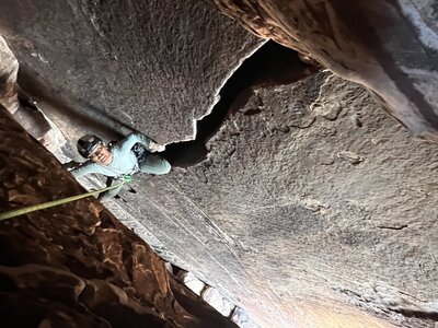 Jessica stemming her way up the P5 cave. Photo taken from the window/portal.