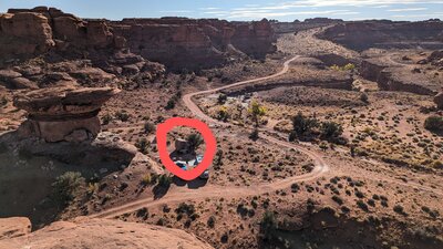 Looking south at dispersed camp spot w/ boulder from north. Lock Hart Rd behind it